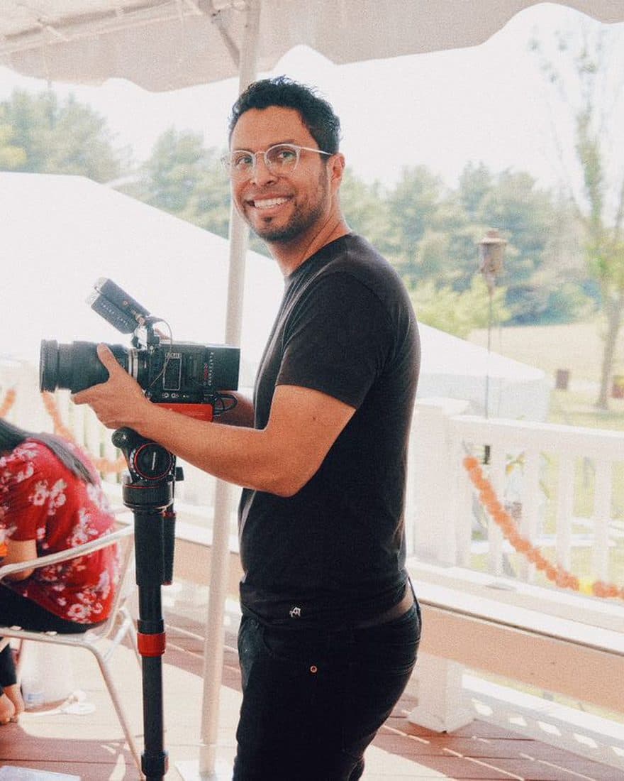 Josué Lemus behind the camera filming a wedding — DC & Twin Cities wedding photographer and videographer